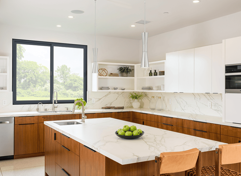 Milgard C700 fiberglass windows in two-tone kitchen with marble countertops