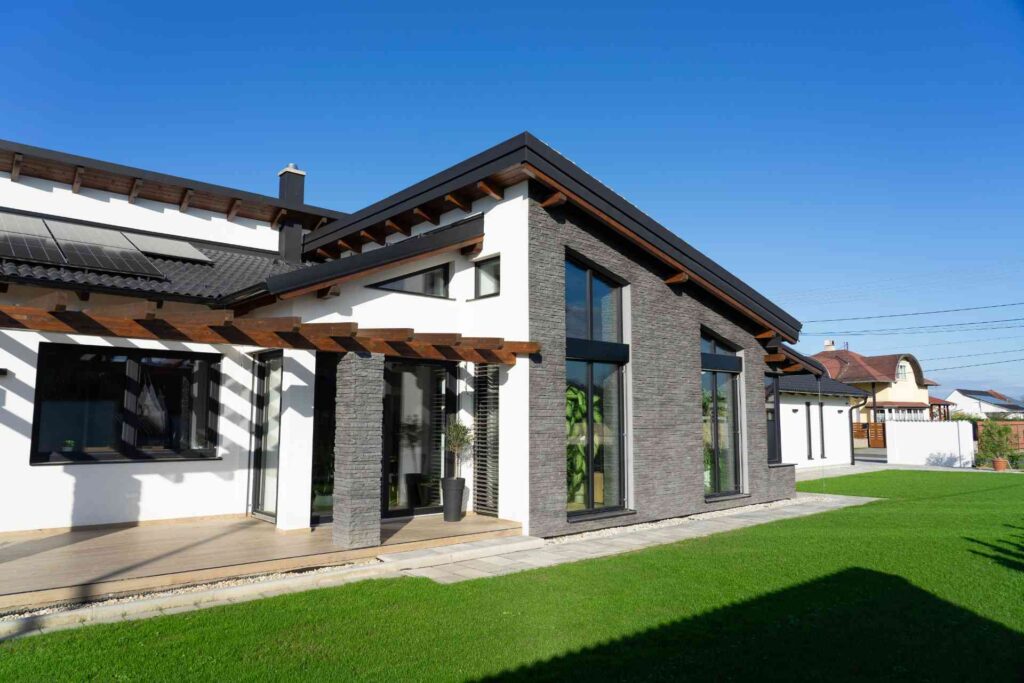 mixed material home exterior with black windows