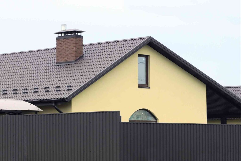 pastel home exterior with black windows